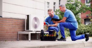 Technician inspecting a heating unit